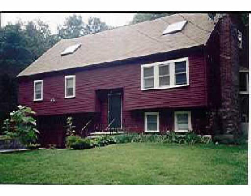 2 Shufelt Road Walpole, MA 02071 - Photo 1 of 1 a front view of a house with a garden