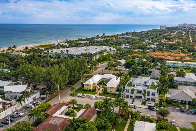 an aerial view of residential houses with outdoor space