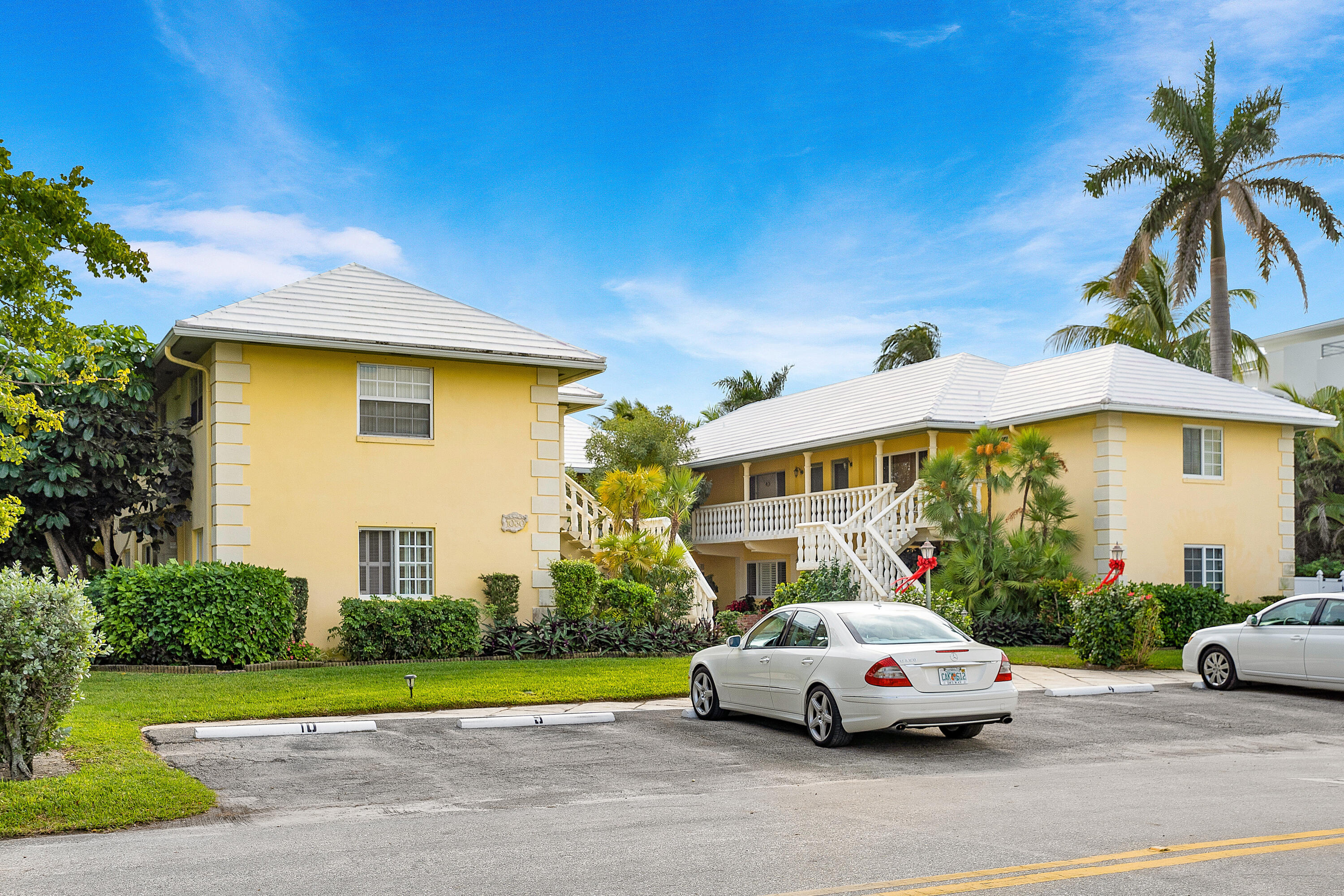 1030 Langer Way, Unit 5 Delray Beach, FL 33483 - Photo 20 of 21 a white car parked in front of a house
