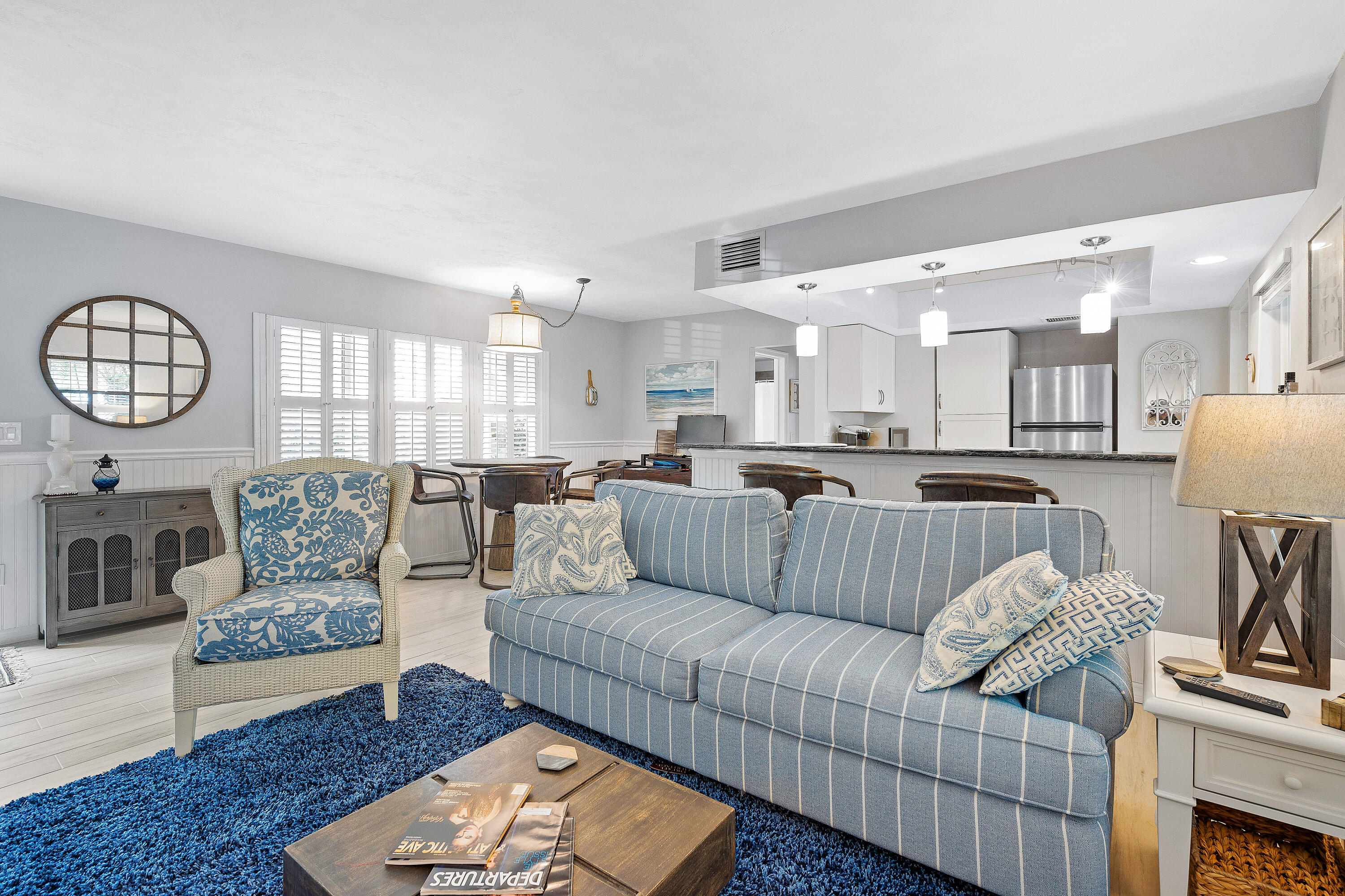 1030 Langer Way, Unit 5 Delray Beach, FL 33483 - Photo 4 of 21 a living room with furniture kitchen view and a chandelier