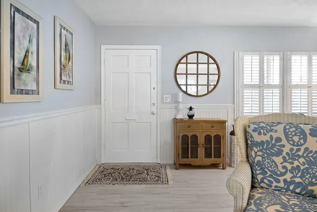a view of a livingroom with furniture and a window