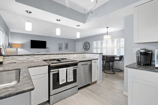 a kitchen with a stove and a microwave