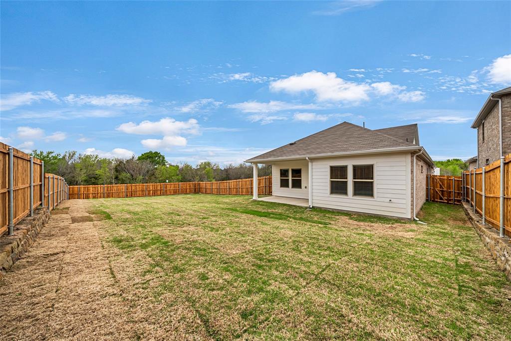 417 Martell Road Lowry Crossing, TX 75069 - Photo 27 of 29 a view of a house with a yard