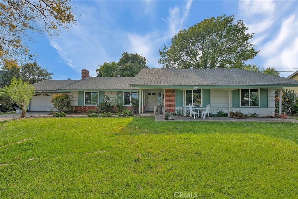 5978 Geremander Avenue Rialto, CA 92377 - Photo 1 of 1 a front view of a house with a garden