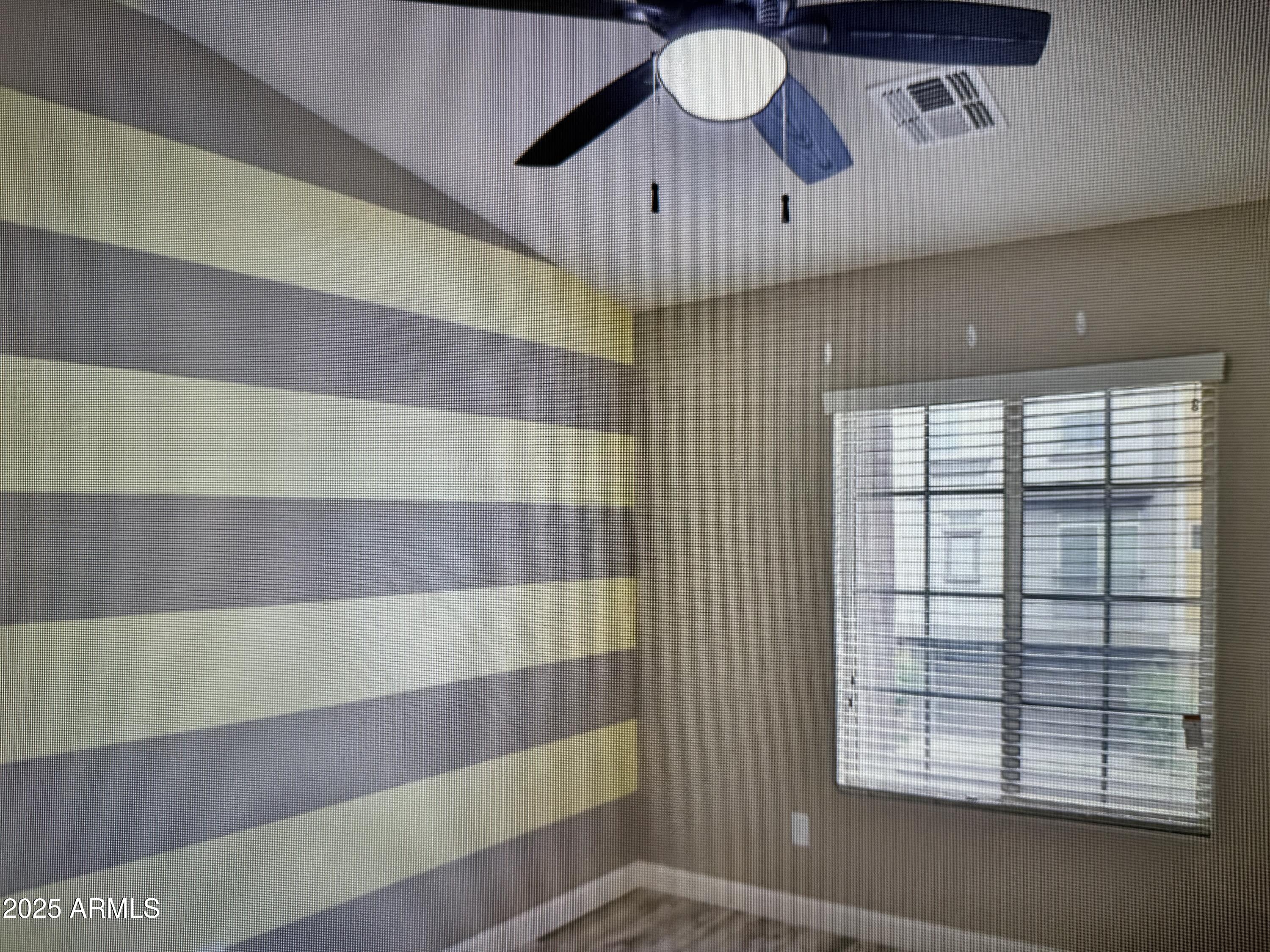 2150 West Alameda Road, Unit 1259 Phoenix, AZ 85085 - Photo 11 of 18 a view of an empty room with a window