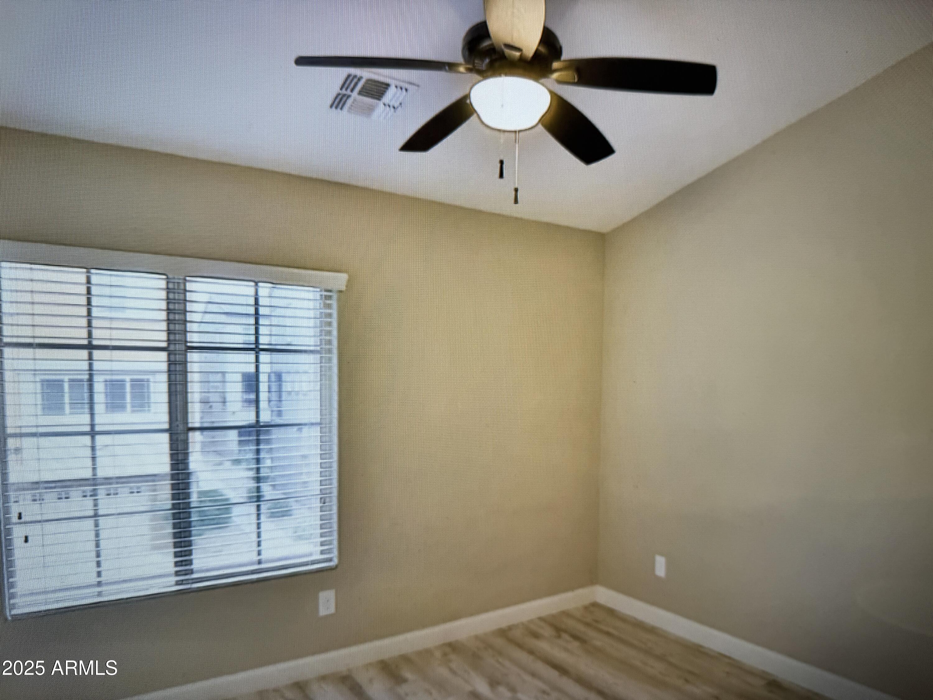 2150 West Alameda Road, Unit 1259 Phoenix, AZ 85085 - Photo 13 of 18 an empty room with windows