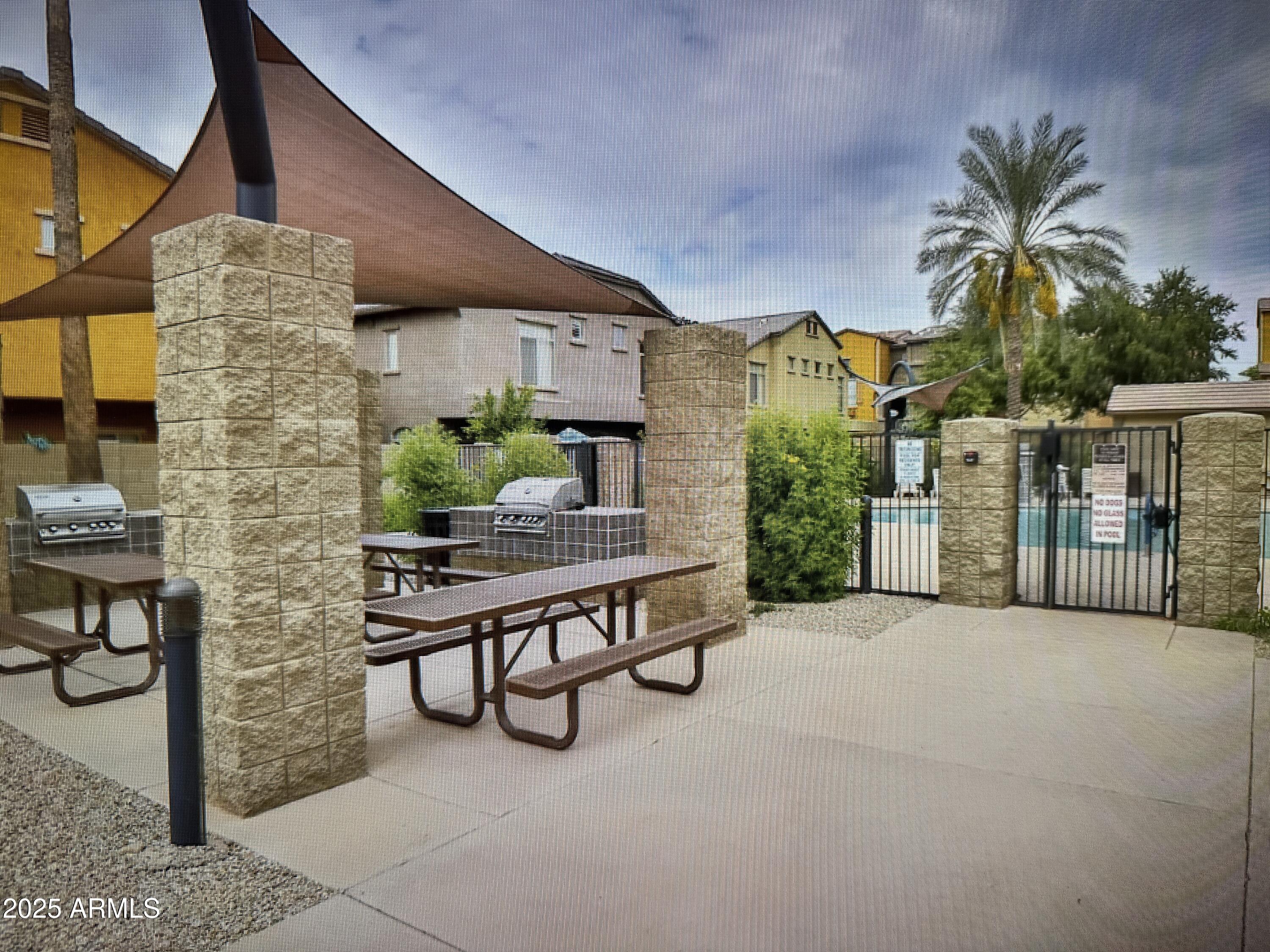 2150 West Alameda Road, Unit 1259 Phoenix, AZ 85085 - Photo 16 of 18 a view of backyard with outdoor seating and plants