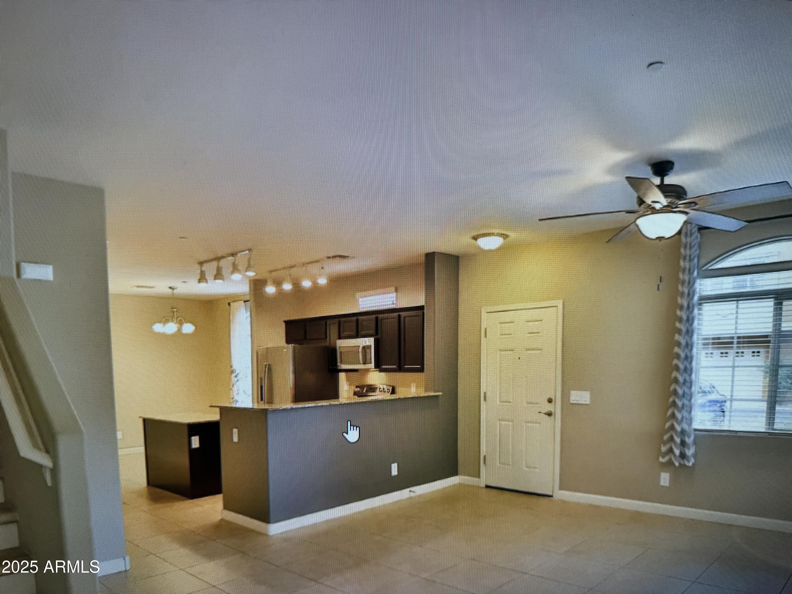 2150 West Alameda Road, Unit 1259 Phoenix, AZ 85085 - Photo 3 of 18 a view of a room with a flat screen tv and windows