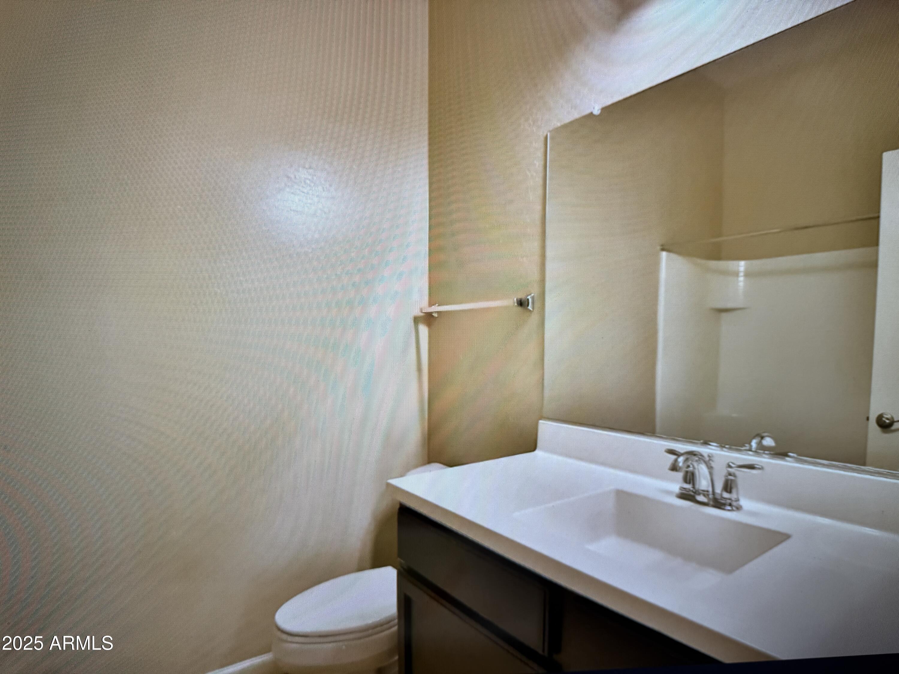 2150 West Alameda Road, Unit 1259 Phoenix, AZ 85085 - Photo 8 of 18 a bathroom with a sink and a toilet