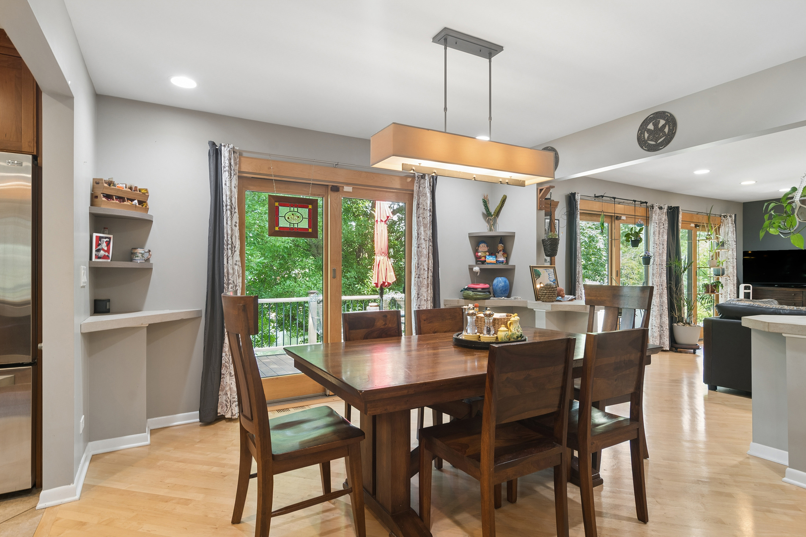 170 South Ela Road Barrington, IL 60010 - Photo 5 of 33 a dining room with wooden floor a chandelier a wooden table and chairs