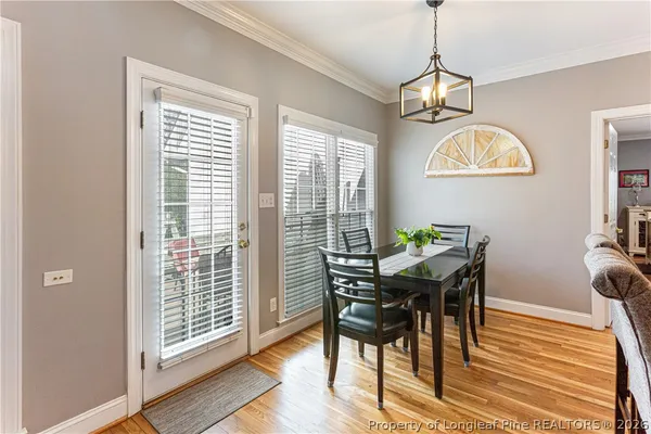 a kitchen with granite countertop a sink stove and refrigerator