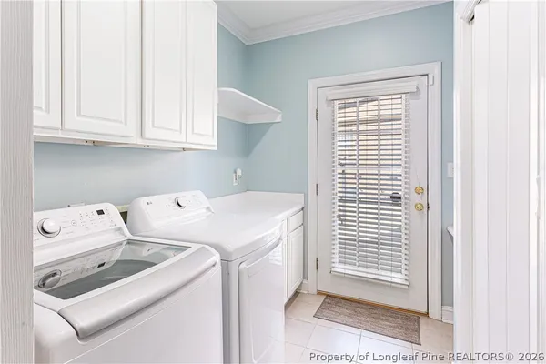 a bathroom with a toilet a sink and a window