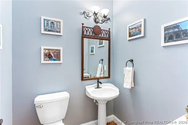 a spacious bedroom with a bed and a large window