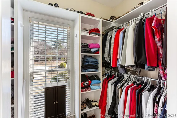 a view of a livingroom with wooden floor and windows