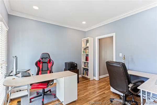 a work room with furniture and windows