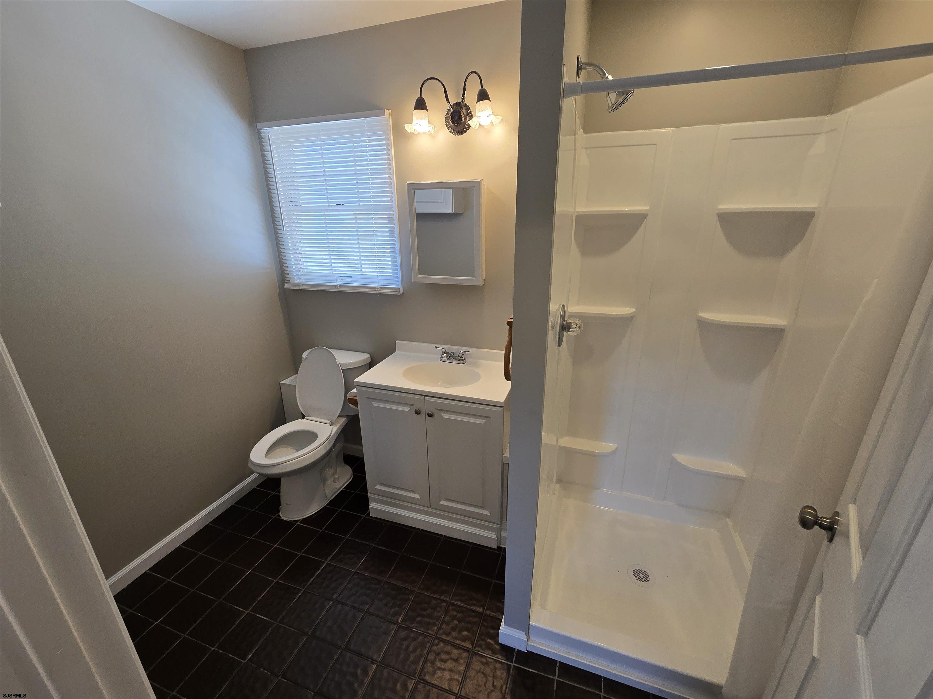 30 Mill Street, Unit C Mays Landing, NJ 08330 - Photo 15 of 15 a bathroom with a sink toilet and shower