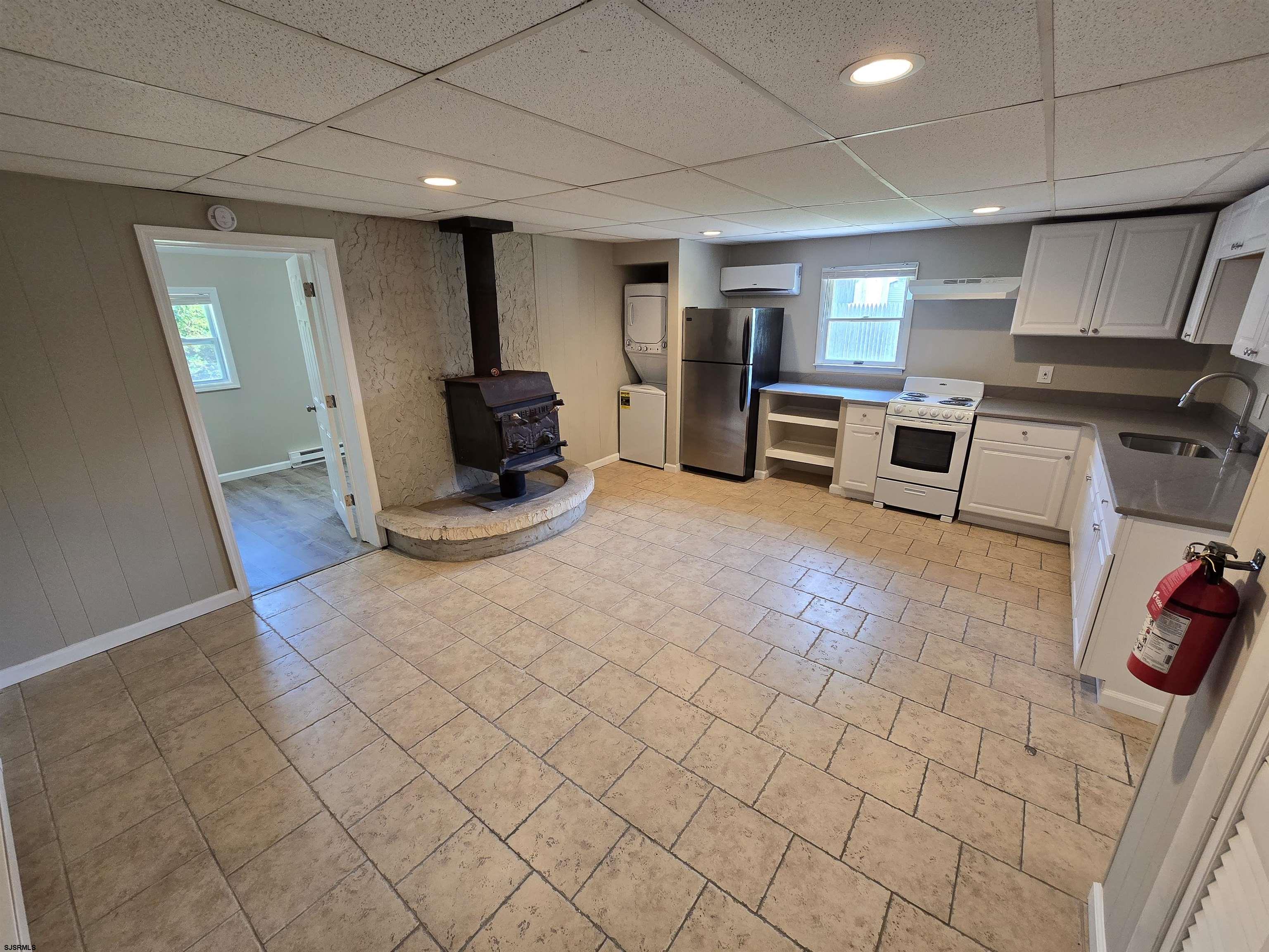 30 Mill Street, Unit C Mays Landing, NJ 08330 - Photo 5 of 15 a view of a livingroom with workspace and a couch