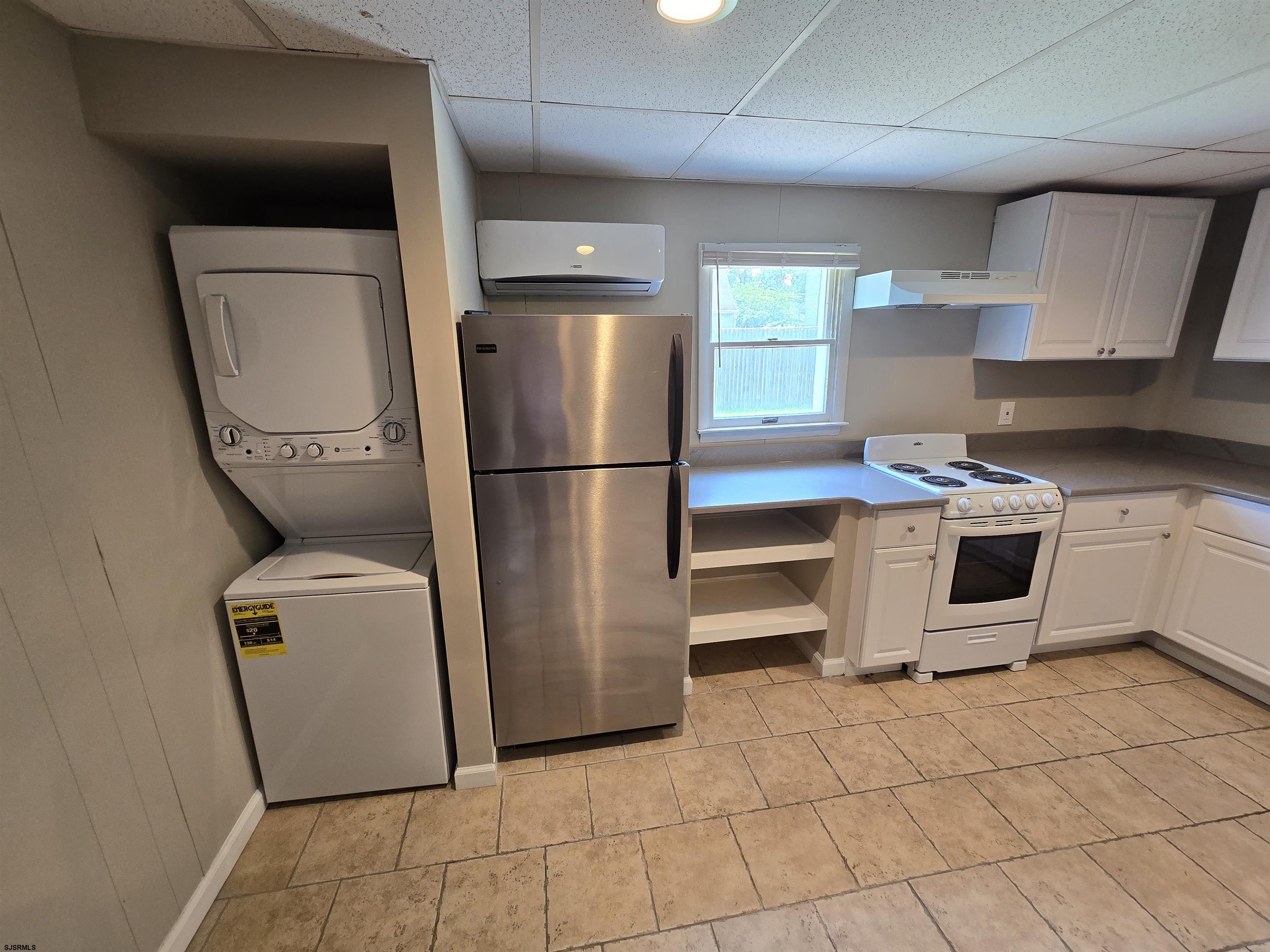 30 Mill Street, Unit C Mays Landing, NJ 08330 - Photo 7 of 15 a kitchen with a refrigerator sink and cabinets