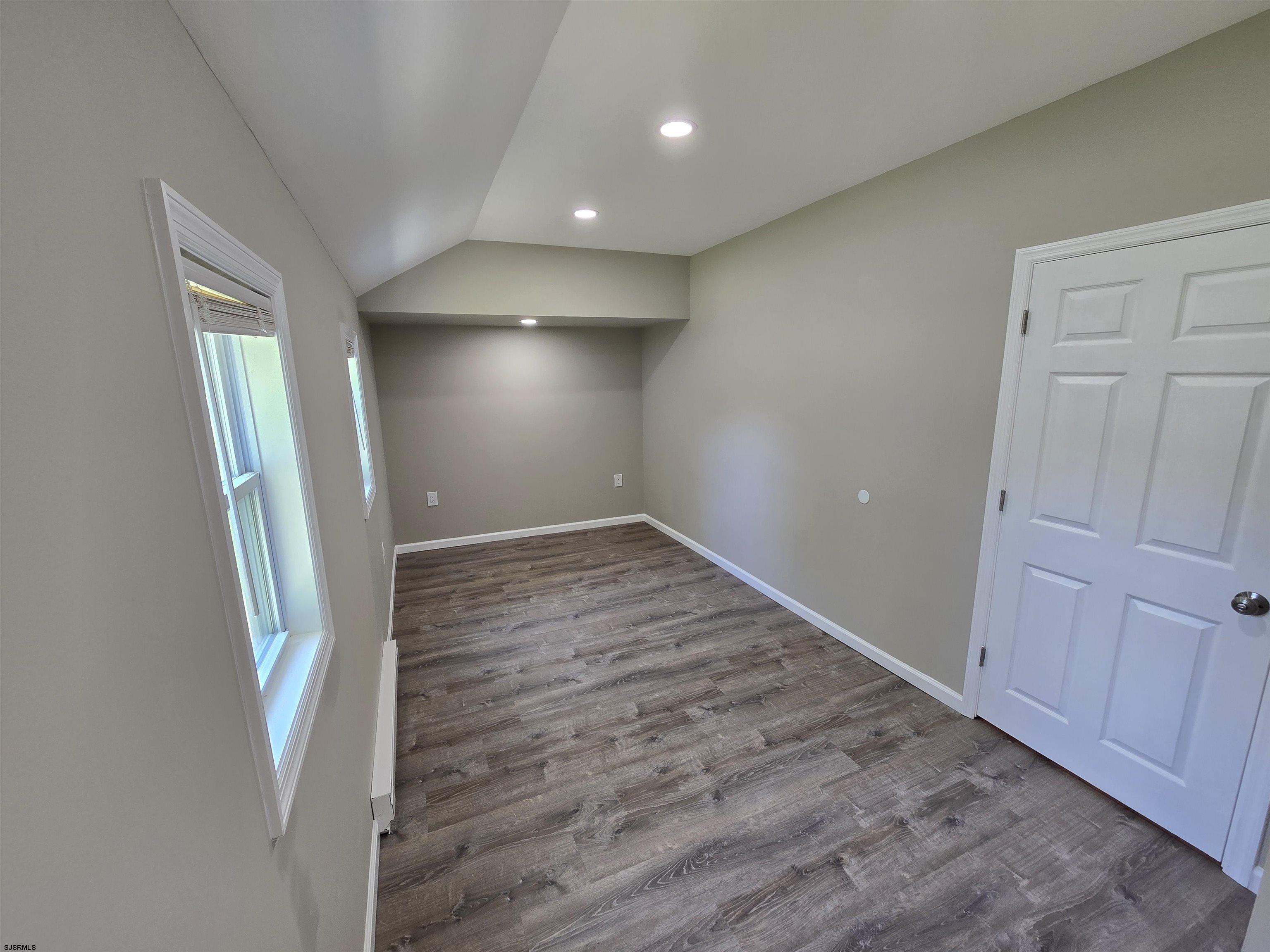 30 Mill Street, Unit C Mays Landing, NJ 08330 - Photo 9 of 15 an empty room with wooden floor and entrance