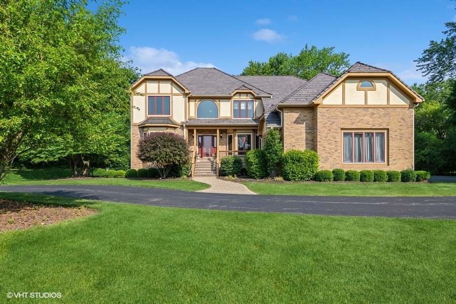 5908 Kildeer Court Long Grove, IL 60047 - Photo 1 of 23 a front view of a house with a garden