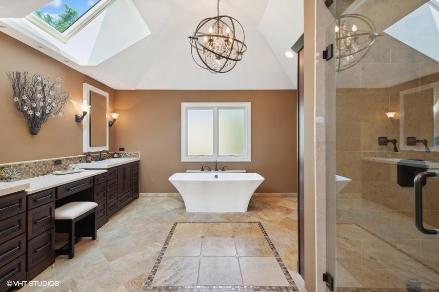 5908 Kildeer Court Long Grove, IL 60047 - Photo 11 of 23 a bathroom with a sink a mirror and a bathtub
