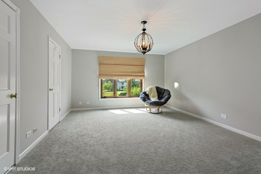 5908 Kildeer Court Long Grove, IL 60047 - Photo 12 of 23 a view of a room with a large space and chandelier