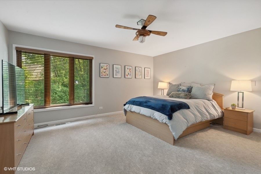 5908 Kildeer Court Long Grove, IL 60047 - Photo 13 of 23 a bedroom with a large bed and a large window