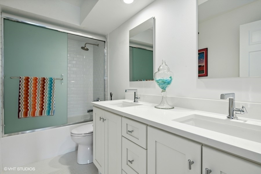 5908 Kildeer Court Long Grove, IL 60047 - Photo 16 of 23 a bathroom with a granite countertop sink mirror vanity and toilet