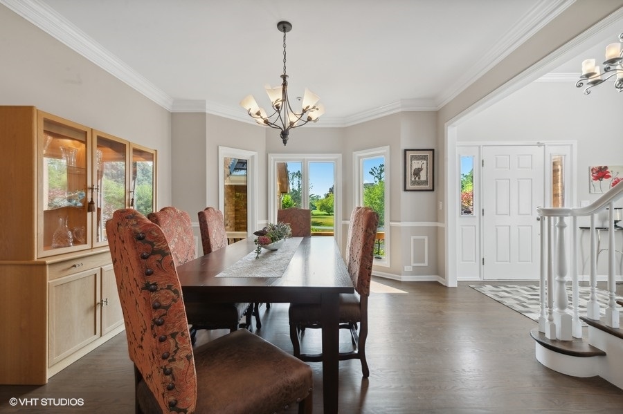 5908 Kildeer Court Long Grove, IL 60047 - Photo 3 of 23 a view of a dining room with furniture window and wooden floor