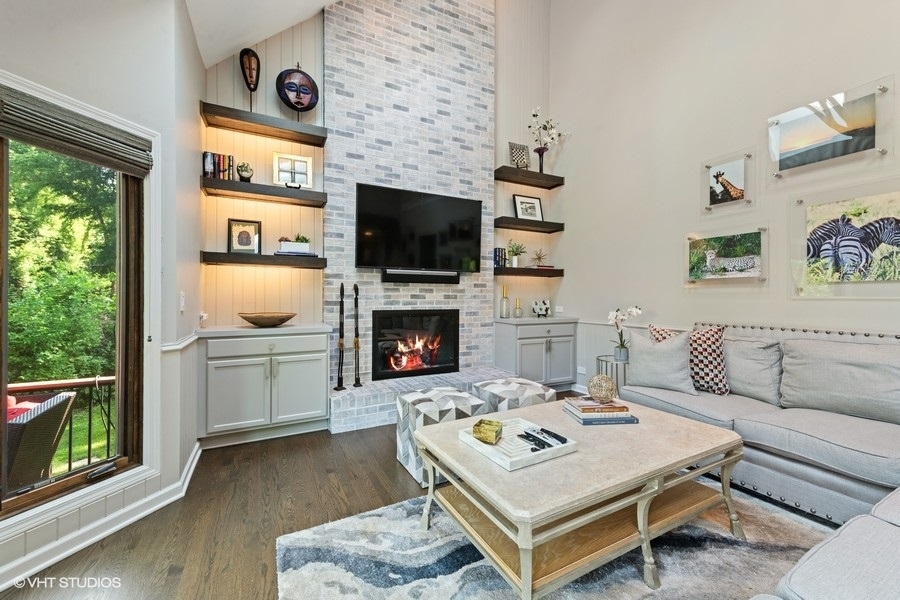 5908 Kildeer Court Long Grove, IL 60047 - Photo 7 of 23 a living room with furniture a flat screen tv and a fireplace