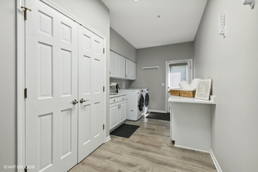 5908 Kildeer Court Long Grove, IL 60047 - Photo 9 of 23 a kitchen with white cabinets and sink