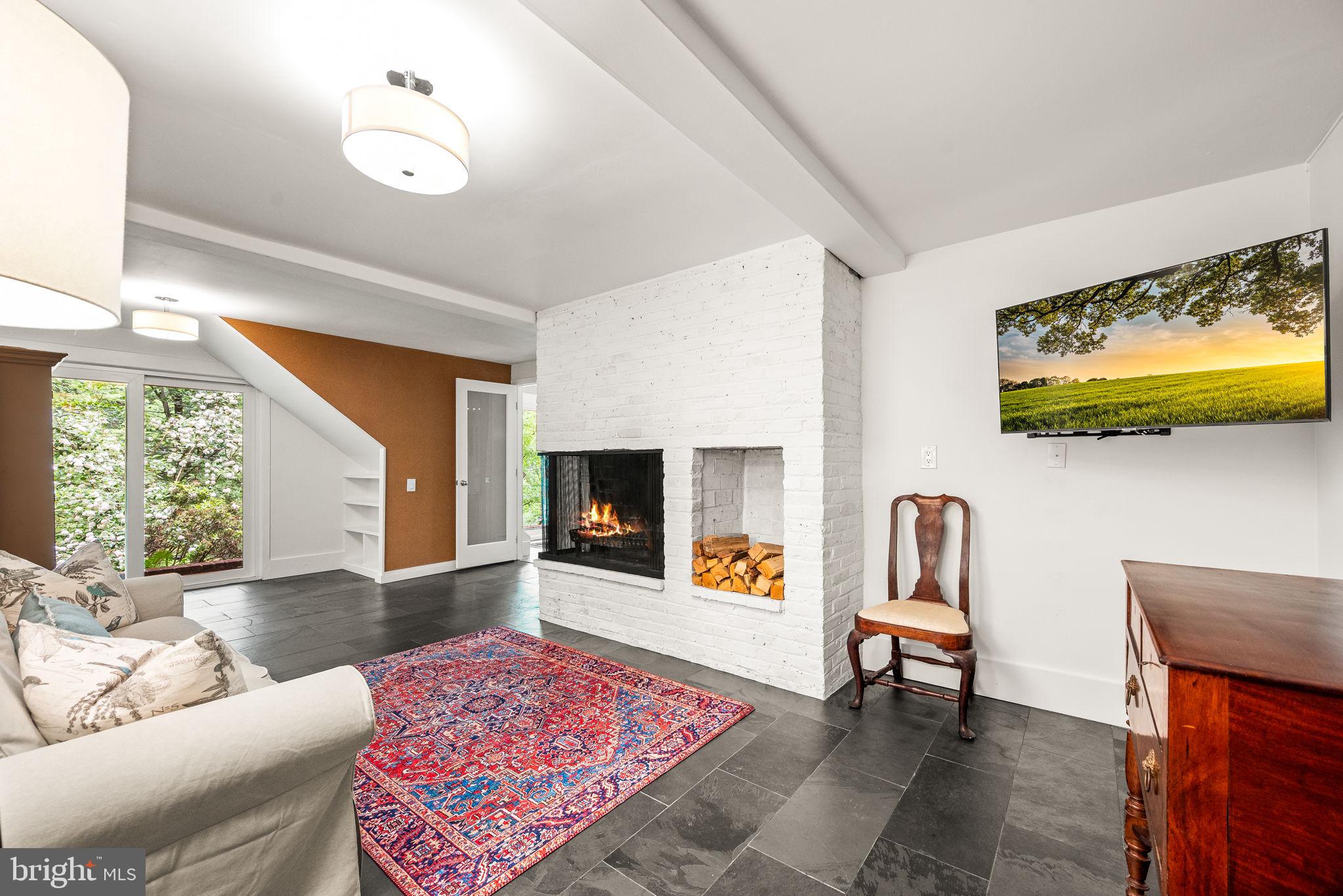 422 Oak Valley Road Media, PA 19063 - Photo 6 of 34 Family Room with slate tiles and a fireplace