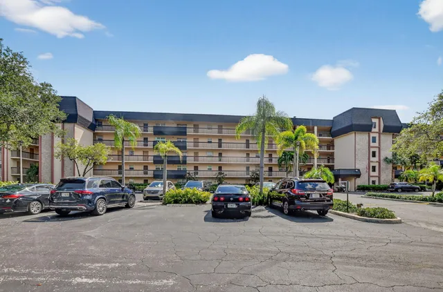 a view of cars parked in front of a building