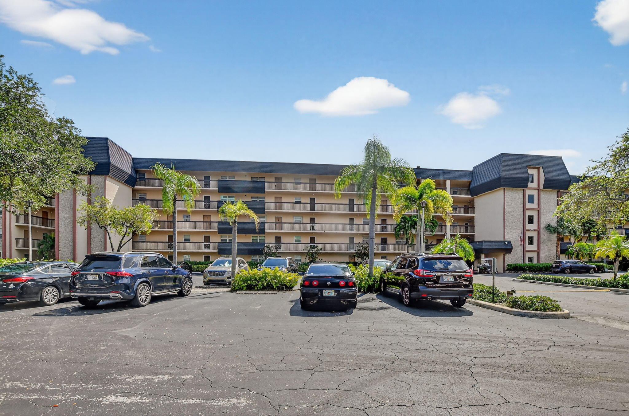 a view of cars parked in front of a building