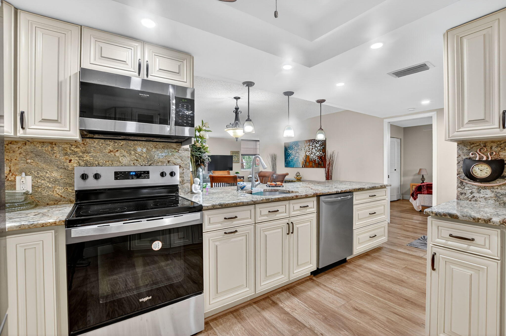 5340 Northwest 2nd Avenue, Unit 226 Boca Raton, FL 33487 - Photo 11 of 39 a kitchen with a sink stove and microwave