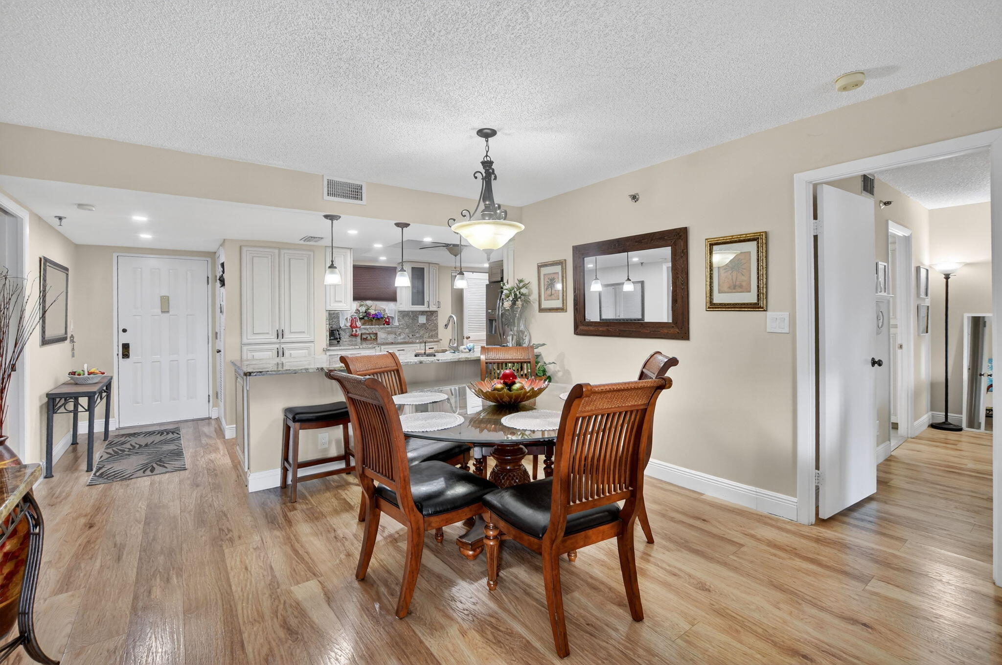 5340 Northwest 2nd Avenue, Unit 226 Boca Raton, FL 33487 - Photo 14 of 39 a view of a dining room with furniture and wooden floor