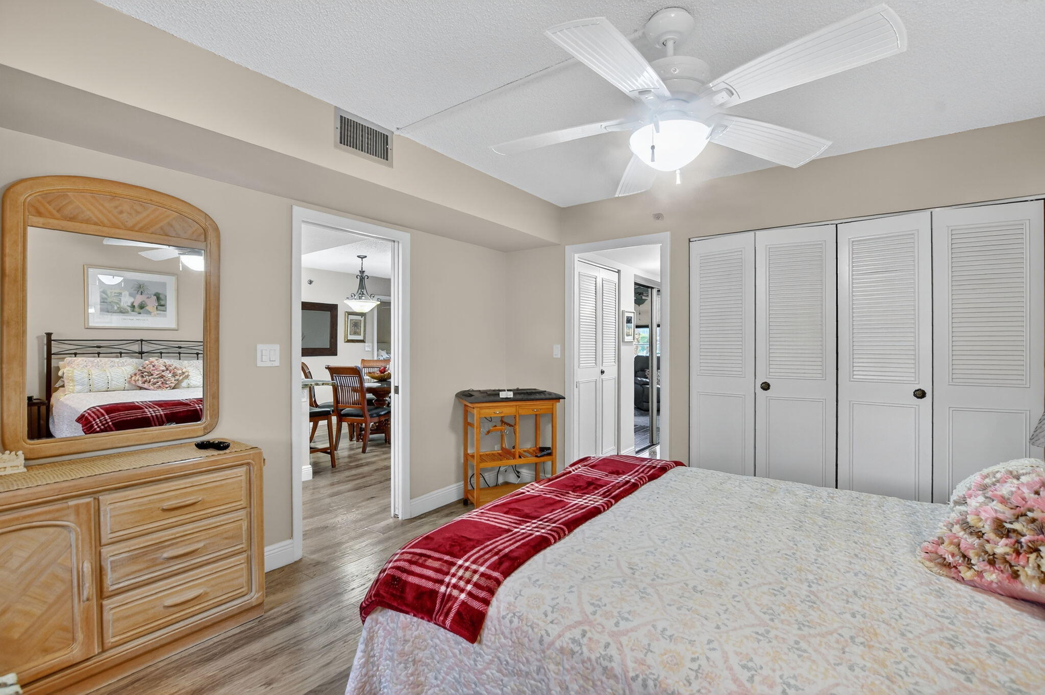 5340 Northwest 2nd Avenue, Unit 226 Boca Raton, FL 33487 - Photo 21 of 39 a bedroom with a bed and a chandelier