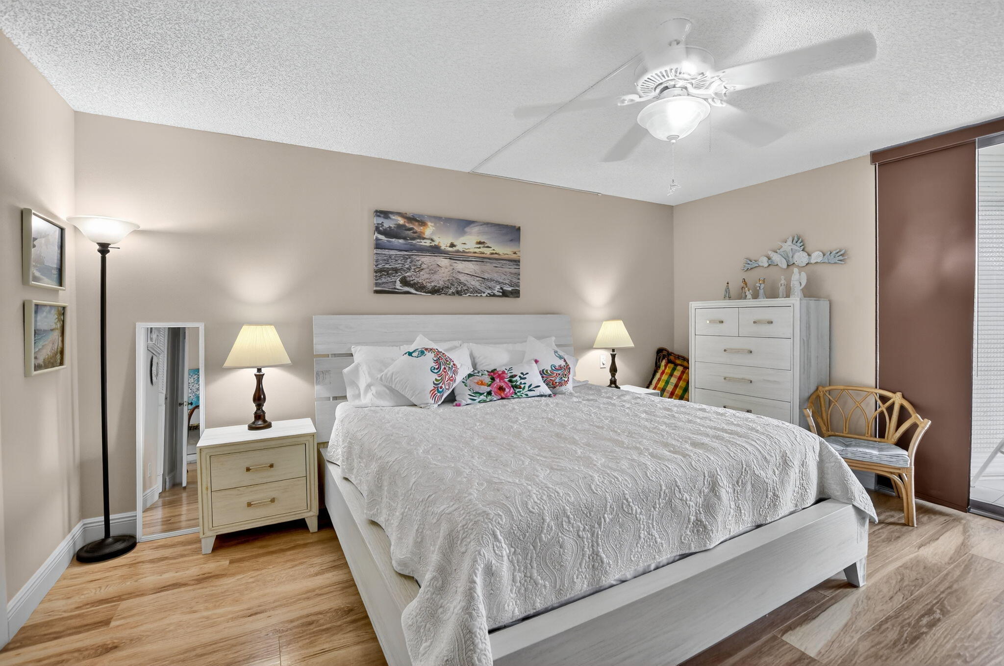 5340 Northwest 2nd Avenue, Unit 226 Boca Raton, FL 33487 - Photo 25 of 39 a bedroom with a bed and a chandelier