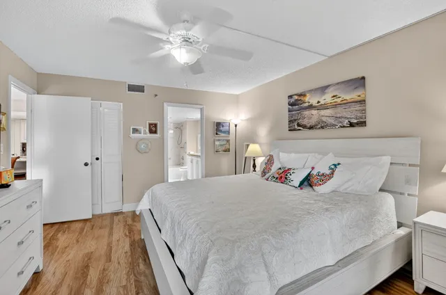 a bedroom with a bed and flat screen tv
