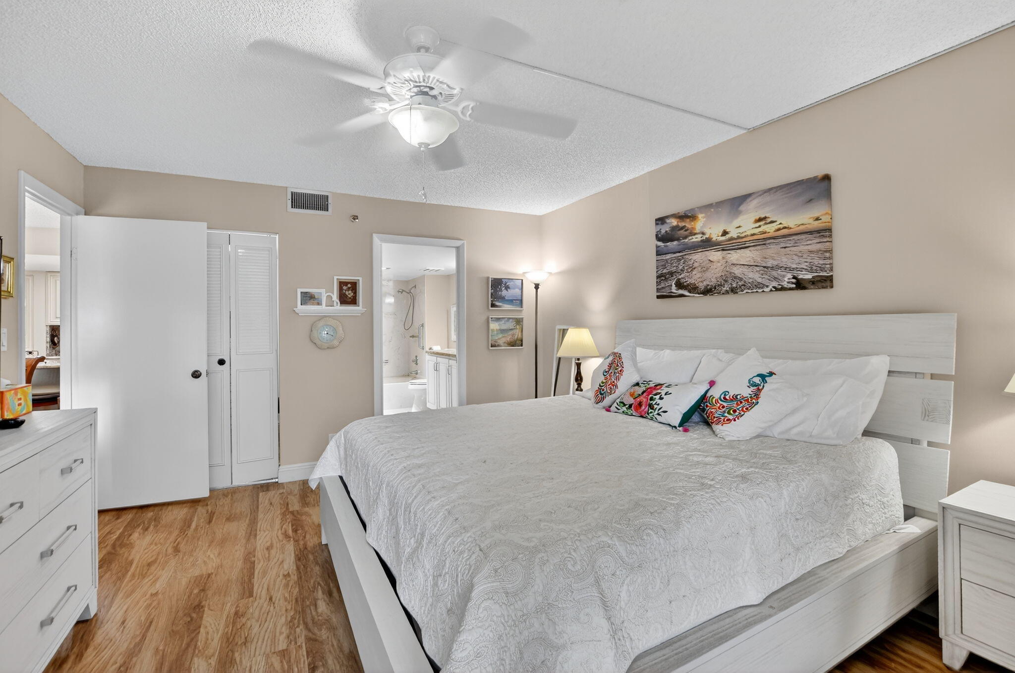 5340 Northwest 2nd Avenue, Unit 226 Boca Raton, FL 33487 - Photo 26 of 39 a bedroom with a large bed and a chandelier