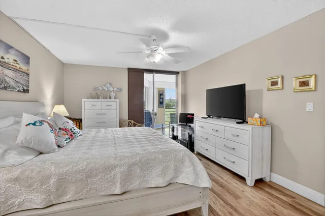 a bathroom with a bathtub shower sink vanity and toilet