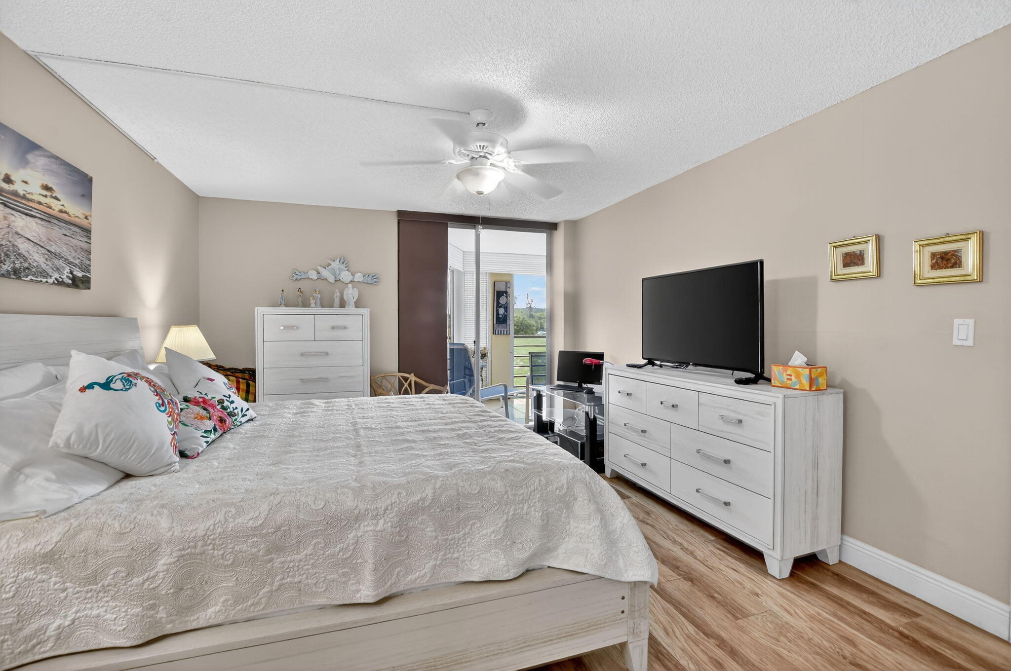 5340 Northwest 2nd Avenue, Unit 226 Boca Raton, FL 33487 - Photo 27 of 39 a bedroom with a bed and flat screen tv