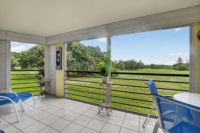 a view of a chairs and table in a patio