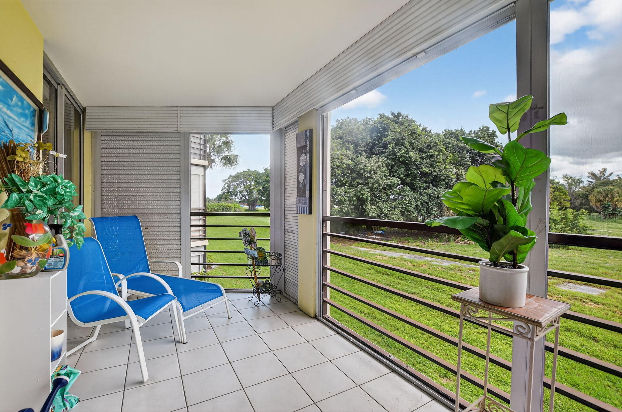 5340 Northwest 2nd Avenue, Unit 226 Boca Raton, FL 33487 - Photo 32 of 39 a view of a chairs and table in a patio