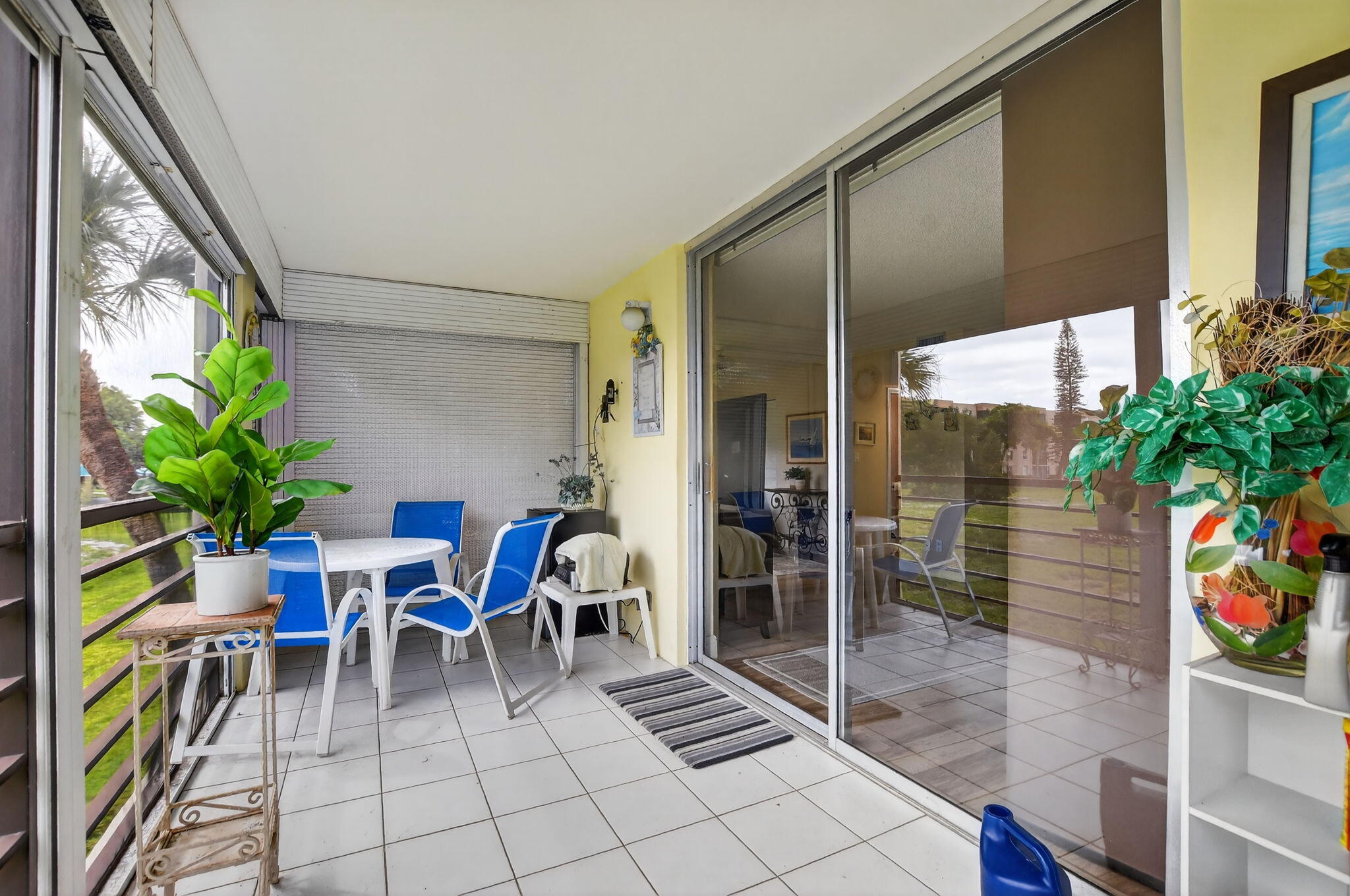 5340 Northwest 2nd Avenue, Unit 226 Boca Raton, FL 33487 - Photo 33 of 39 a view of a porch with chairs and potted plants