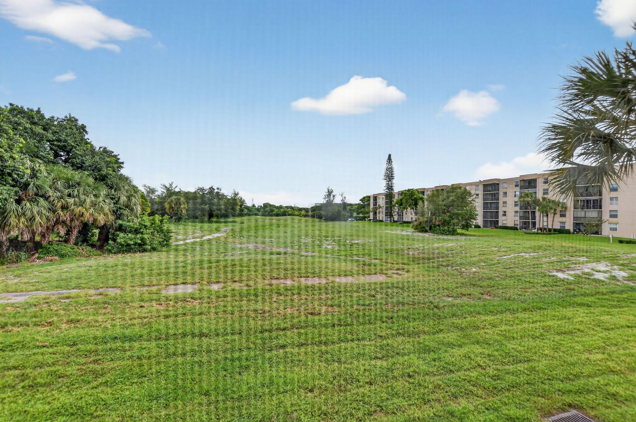 5340 Northwest 2nd Avenue, Unit 226 Boca Raton, FL 33487 - Photo 34 of 39 a view of a house with a big yard