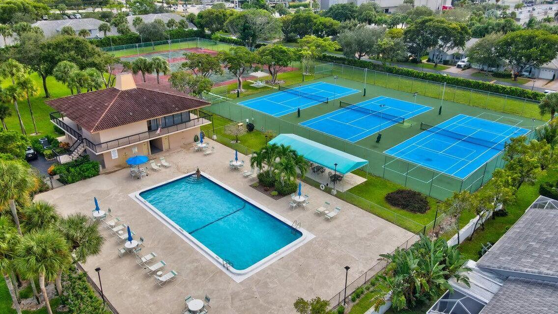 5340 Northwest 2nd Avenue, Unit 226 Boca Raton, FL 33487 - Photo 38 of 39 an aerial view of a pool yard lake and outdoor seating