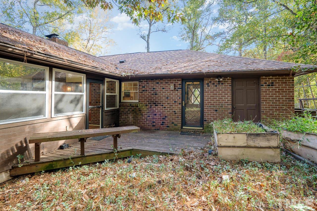 7805 Wakebrook Drive Raleigh, NC 27616 - Photo 4 of 25 a backyard of a house with seating space