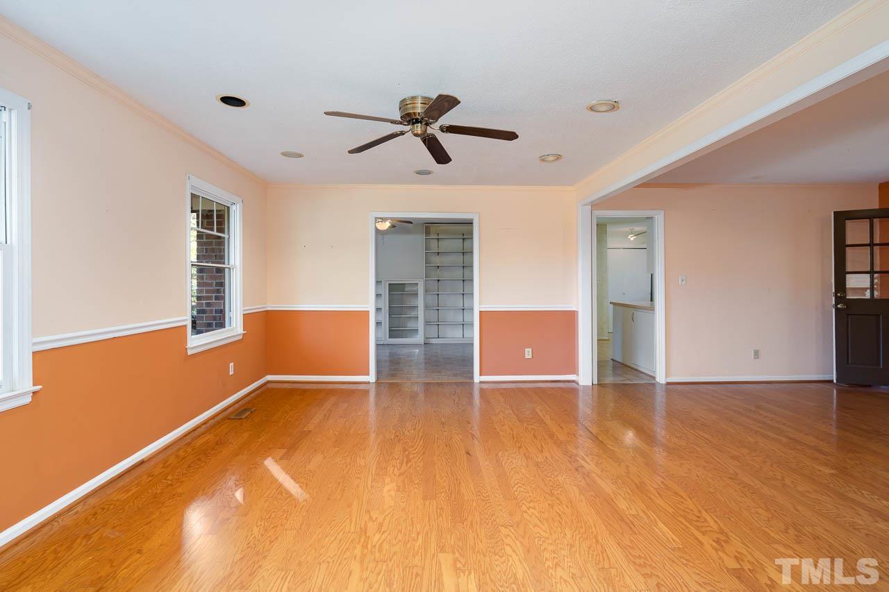 7805 Wakebrook Drive Raleigh, NC 27616 - Photo 8 of 25 a view of an empty room with window and wooden floor