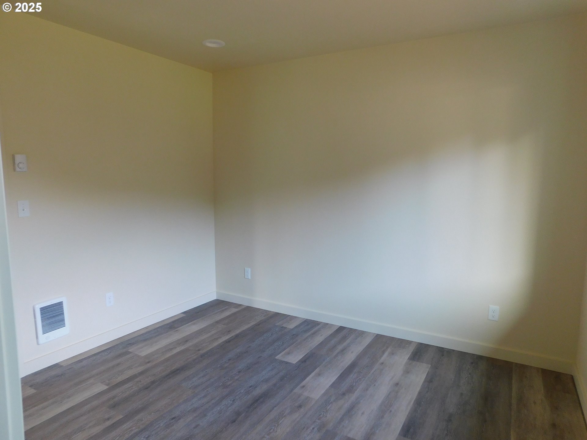 130 East Date Street Powers, OR 97466 - Photo 19 of 29 a view of an empty room and wooden floor